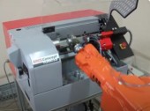 Sistem robotizat pentru alimentarea masinilor unelte